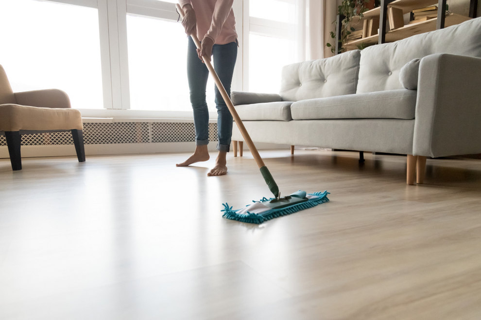 Woman cleaning apartment floor