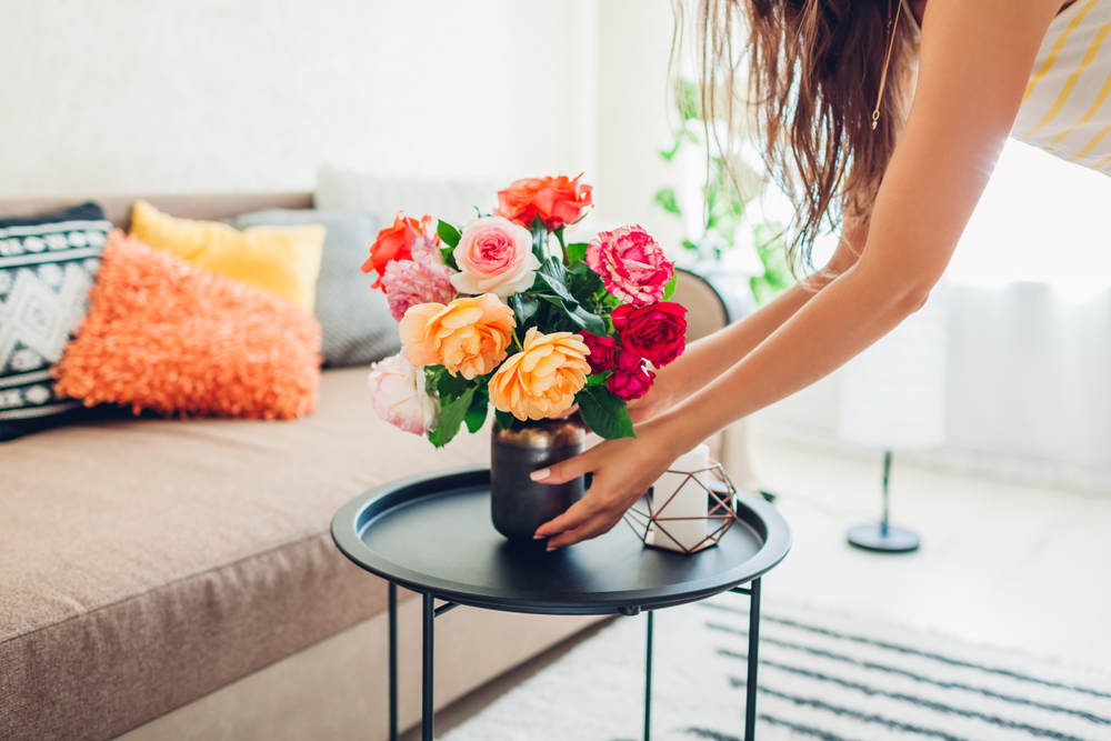 Woman decoration apartment with flowers - Tips to Spruce Up Your Apartment for Spring