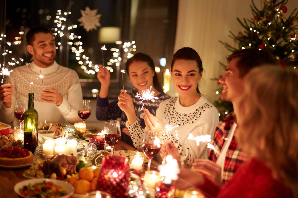 Friends at holiday party in apartment - 3 Steps to Prep Your Apartment for Holiday Guests
